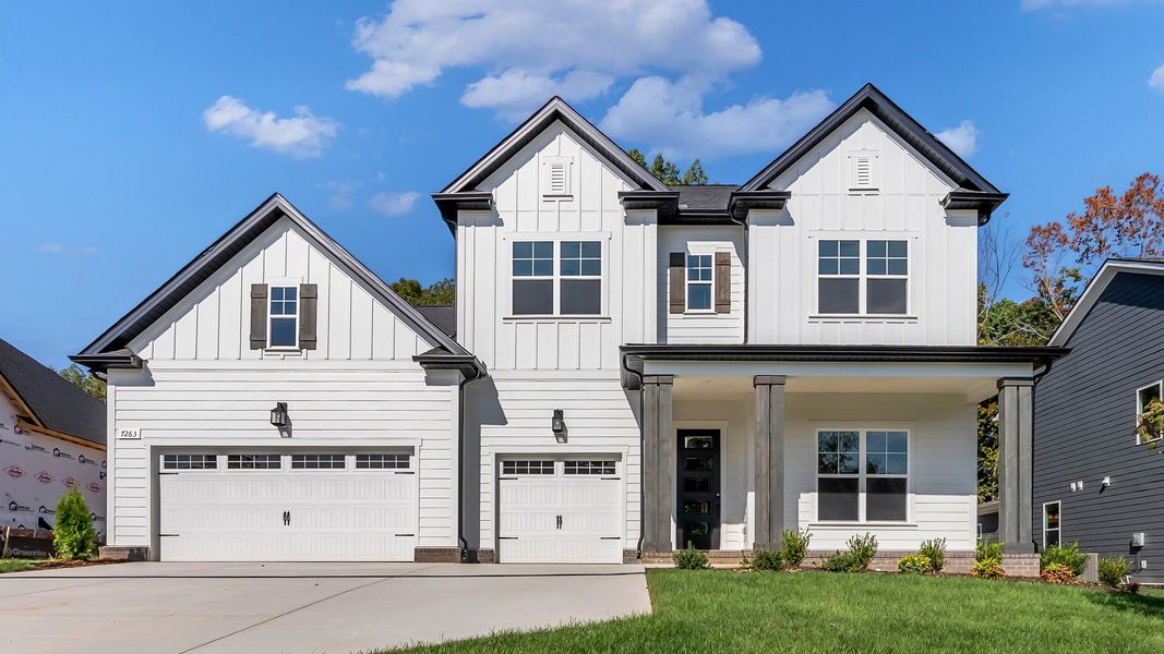 Luxurious house with timeless design, black accents, and pristine landscaping in Roan at Brush Creek. Luxurious house with timeless design, black accents, and pristine landscaping in Roan at Brush Creek.
