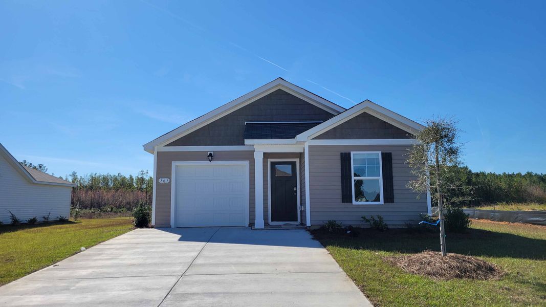 Front exterior of a new home in Jordanville Farms, Galivants Ferry, SC, highlighting curb appeal (Image 1).