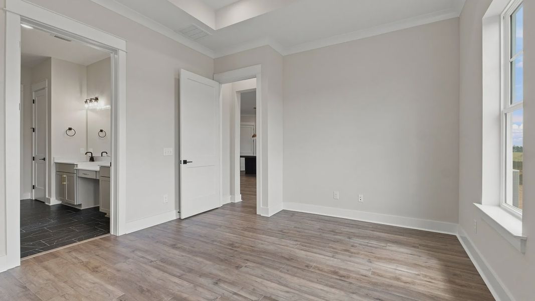 Entrance of connected bathroom and walk-in closet.