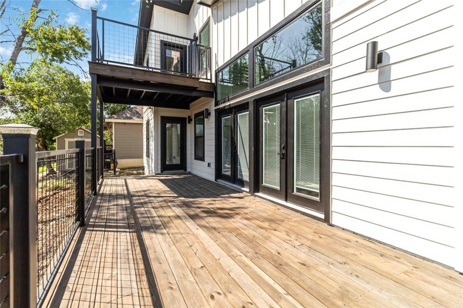Expansive decks on both the first and second levels provide multiple spaces for outdoor living and entertaining. Expansive decks on both the first and second levels provide multiple spaces for outdoor living and entertaining.