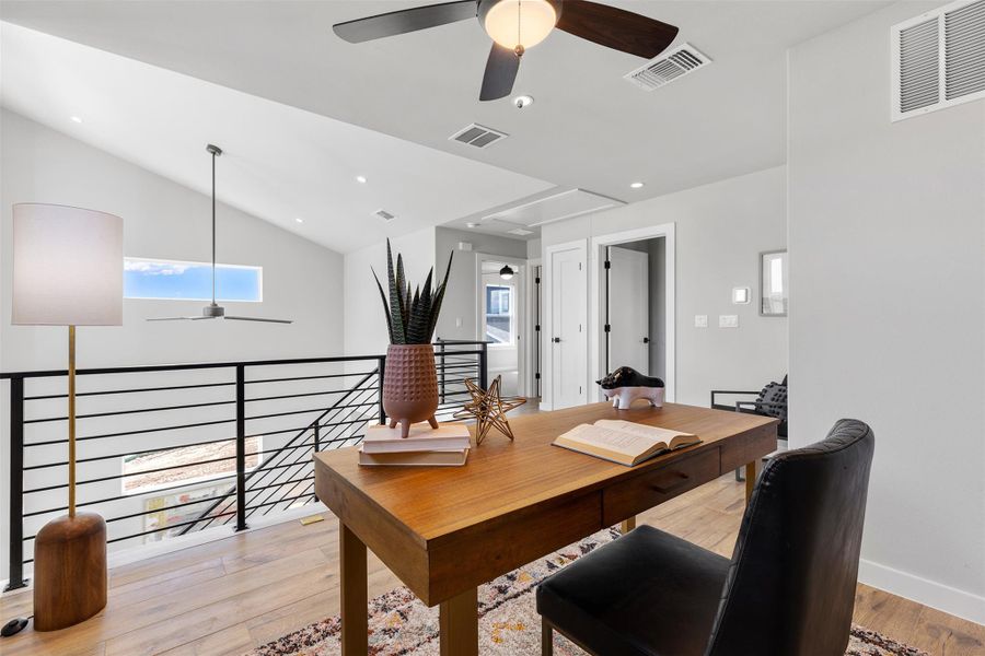 Office with ceiling fan, light wood-style floors, vaulted ceiling, recessed lighting, and attic access