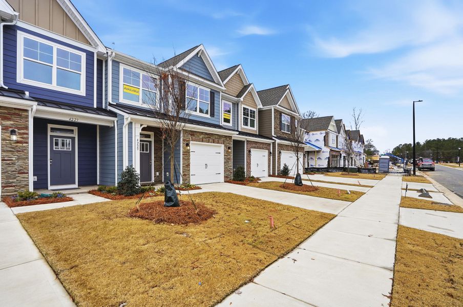 Front exterior of a new home in Harrisburg Village Townhomes, Harrisburg, NC, highlighting curb appeal (Image 21).