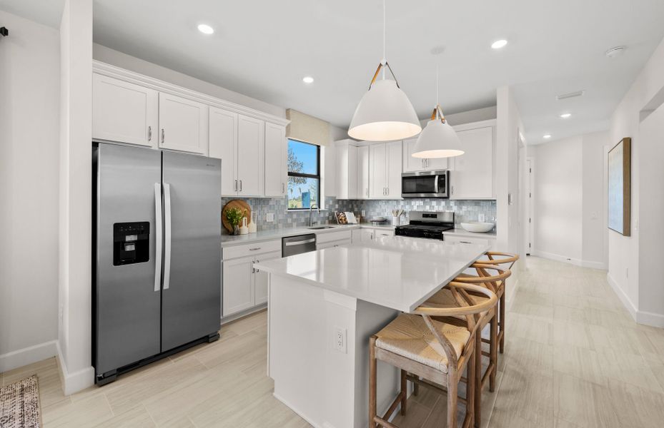 Kitchen with large center island and stainless steel appliances