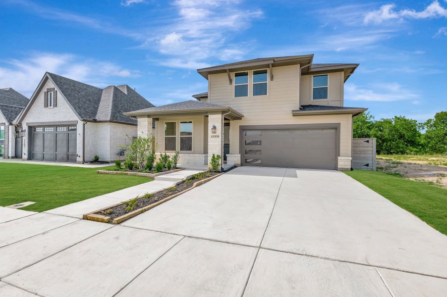 Front exterior of a new home in Treeline, Justin, TX, highlighting curb appeal (Image 2). Front exterior of a new home in Treeline, Justin, TX, highlighting curb appeal (Image 2).