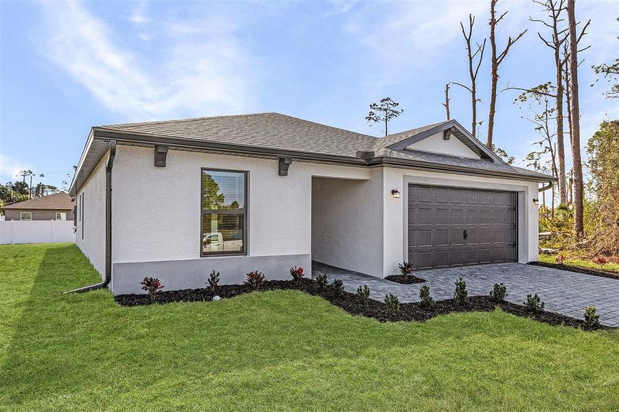 Front exterior of a new home in , North Port, FL, highlighting curb appeal (Image 2). Front exterior of a new home in , North Port, FL, highlighting curb appeal (Image 2).
