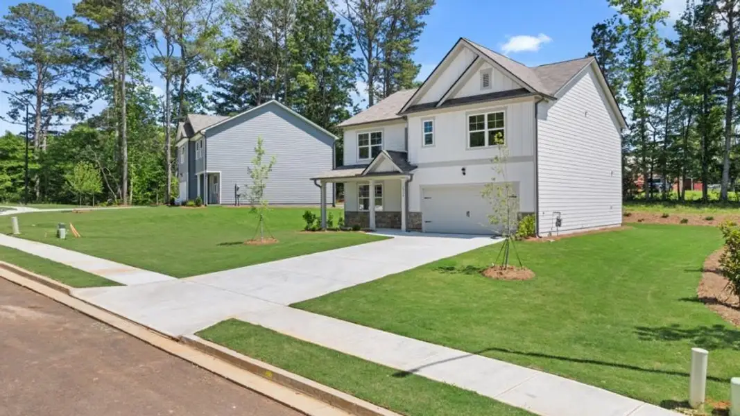 Front exterior of a new home in Fairhaven, Lithia Springs, GA, highlighting curb appeal (Image 18).