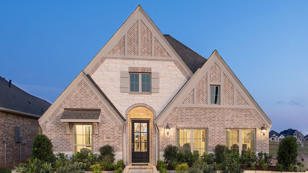 Front exterior of a new home in Candela, Richmond, TX, highlighting curb appeal (Image 2).