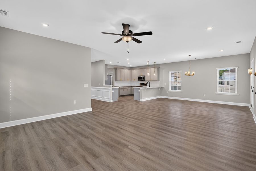 Open Living Room, Breakfast Area & Foyer Hallway at 245 James Drive – Dunham Marsh