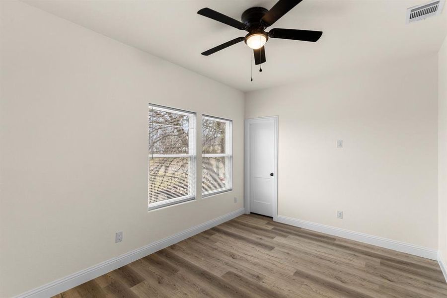 Unfurnished room featuring light hardwood / wood-style floors and ceiling fan