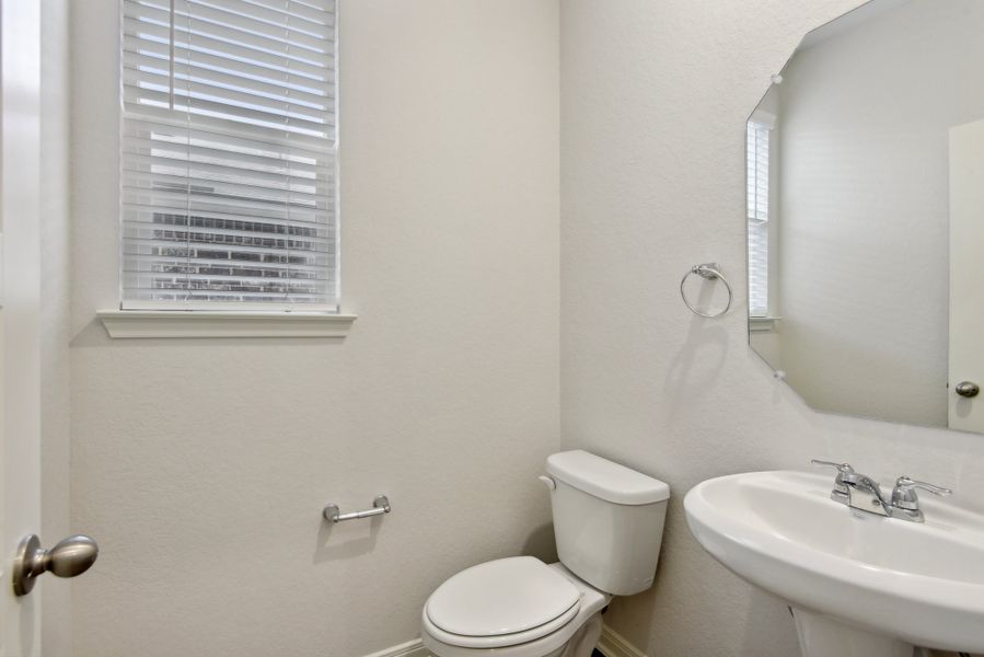 Powder room in the Red River floorplan at a Meritage Homes community.