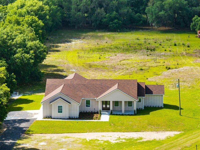 Front exterior of a new home in , Yeehaw Junction, FL, highlighting curb appeal (Image 25).
