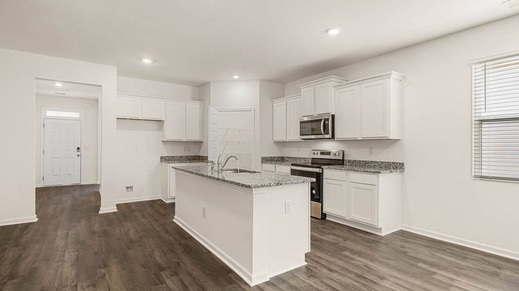 Representative furnished interior of a home built from the Dennis by D.R. Horton in Glenmaye, Hampton (Image 8).
