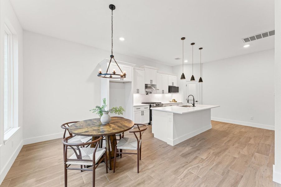 Bright and airy dining space overlooking the backyard, ideal for family meals and gatherings, with modern lighting and open views to the kitchen and living room. Bright and airy dining space overlooking the backyard, ideal for family meals and gatherings, with modern lighting and open views to the kitchen and living room.