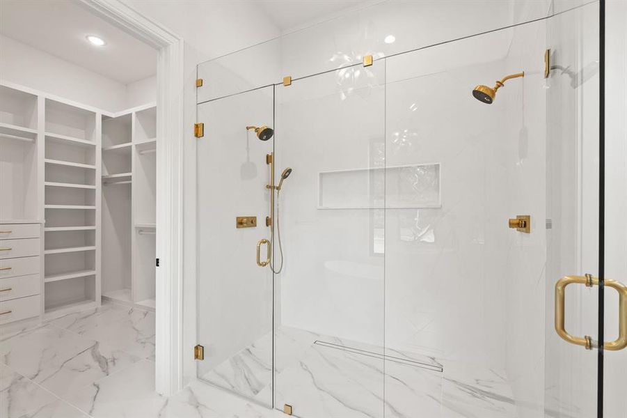Mast Bathroom featuring a spacious closet, a marble finish shower, light marble finish floors, and recessed lighting Mast Bathroom featuring a spacious closet, a marble finish shower, light marble finish floors, and recessed lighting