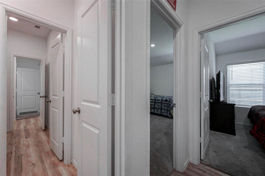 Dedicated laundry room with shelving and space for full-size washer/dryer. Functional layout in a Sunterra home zoned to Freeman High School. Dedicated laundry room with shelving and space for full-size washer/dryer. Functional layout in a Sunterra home zoned to Freeman High School.