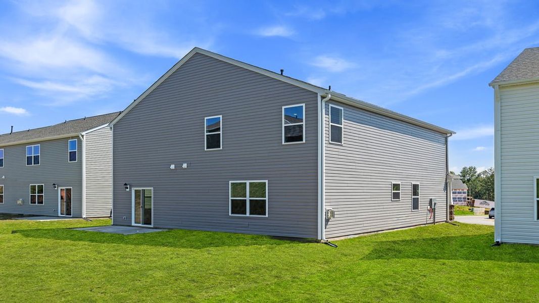 Exterior details and patio area of a home in Durbin Meadows Traditions, Fountain Inn (Image 18).