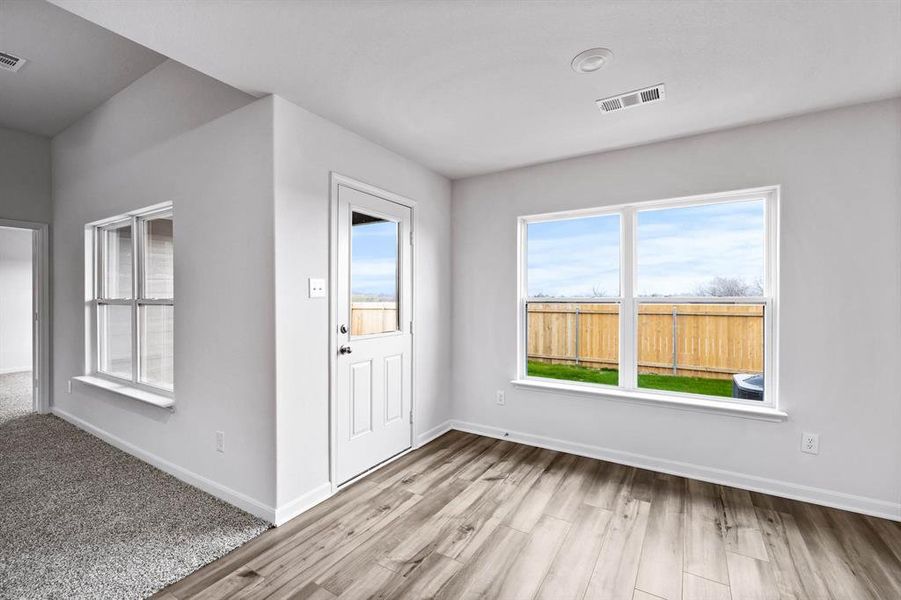 Entrance foyer featuring light hardwood / wood-style flooring