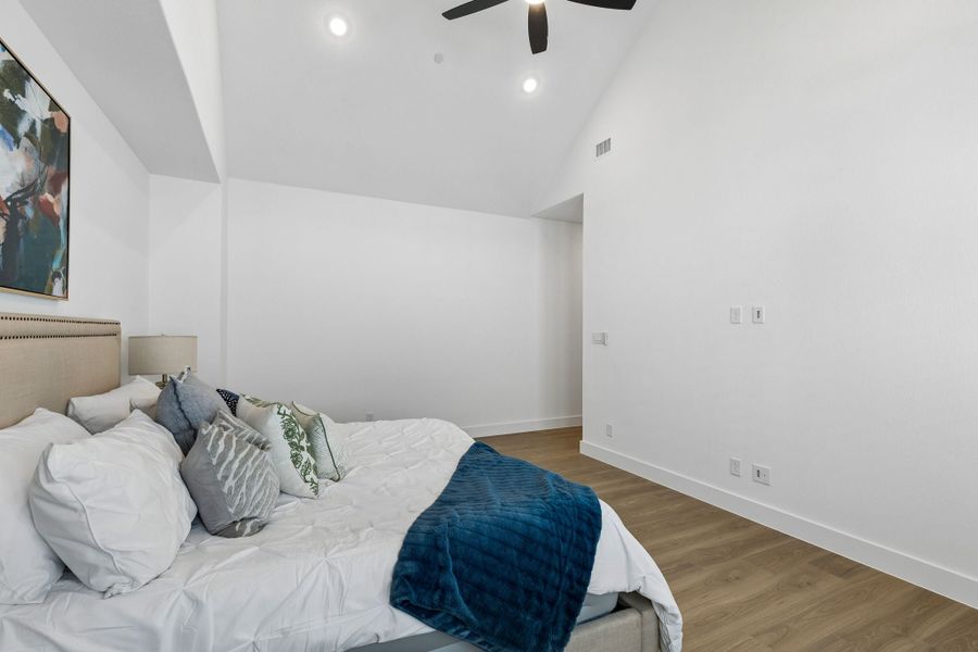 Representative furnished interior of a home built from the Roosevelt by Centre Living Homes in Newman Village Townhomes, Frisco (Image 27).