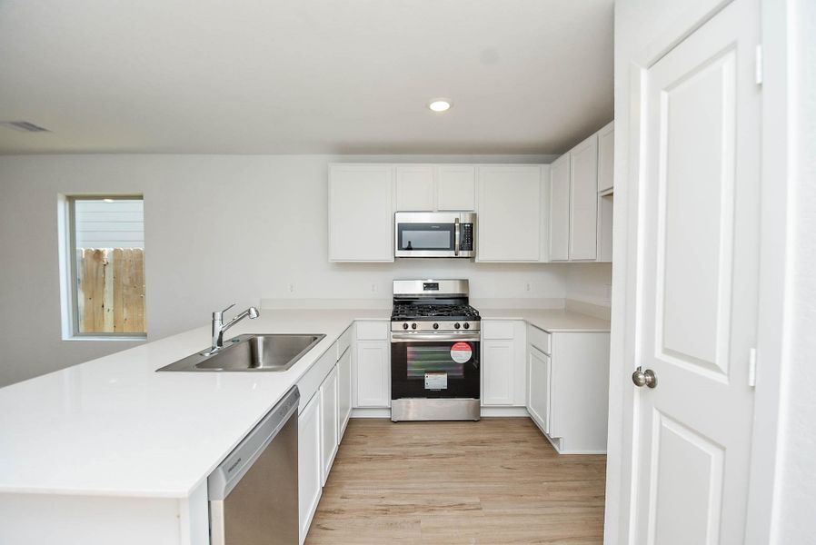 Furnished interior view inside a new home in Ladera Trails, Conroe (Image 6).