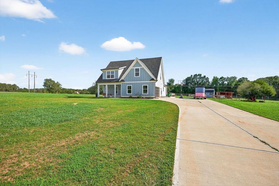 Front exterior of a new home in , Bogart, GA, highlighting curb appeal (Image 22).