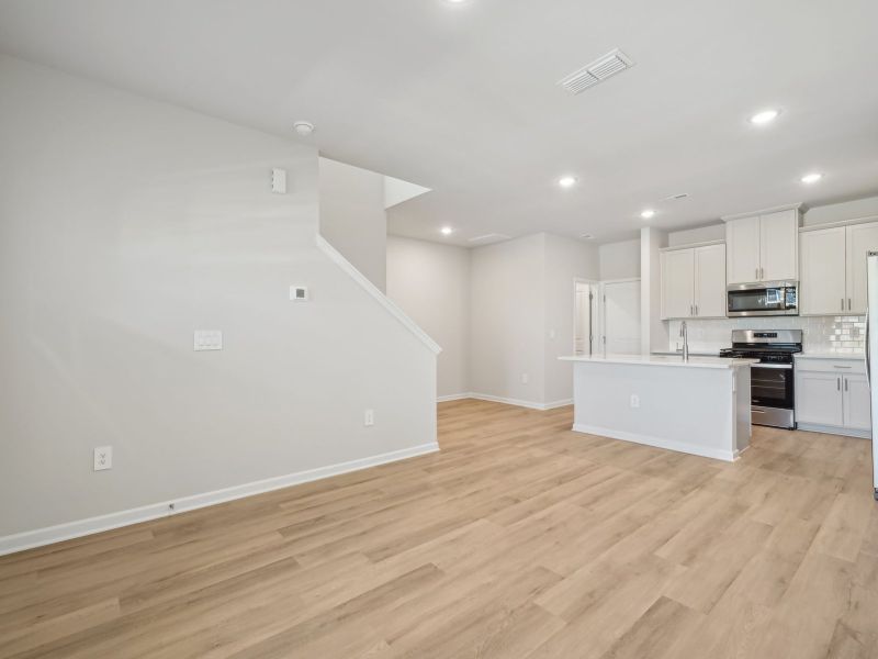 An open-concept great room is perfect for spending cozy nights in.