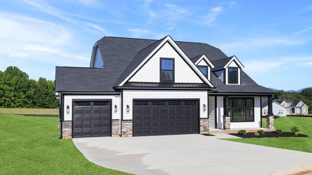 Front exterior of a new home in Rutledge Estates, Woodruff, SC, highlighting curb appeal (Image 2). Front exterior of a new home in Rutledge Estates, Woodruff, SC, highlighting curb appeal (Image 2).