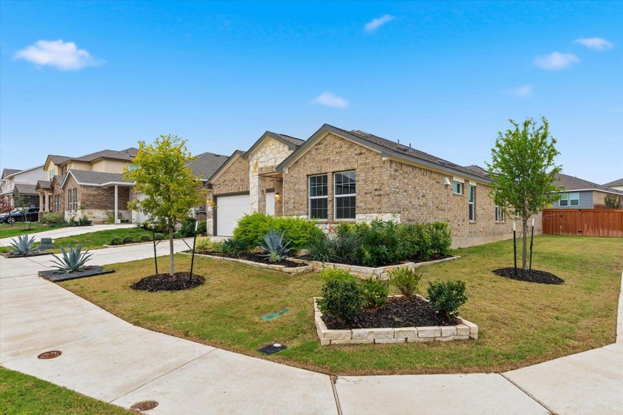 Front exterior of a new home in Thunder Rock: Watermill Collection, Marble Falls, TX, highlighting curb appeal (Image 2).