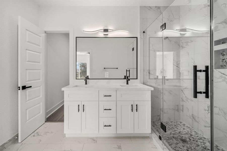 Master bedroom with its ensuite bathroom - his and hers sink with large walk-in shower