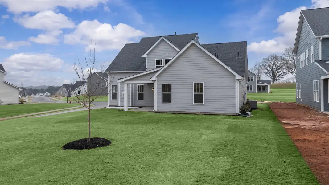 Established charm meets functional outdoor living with a spacious rear covered porch