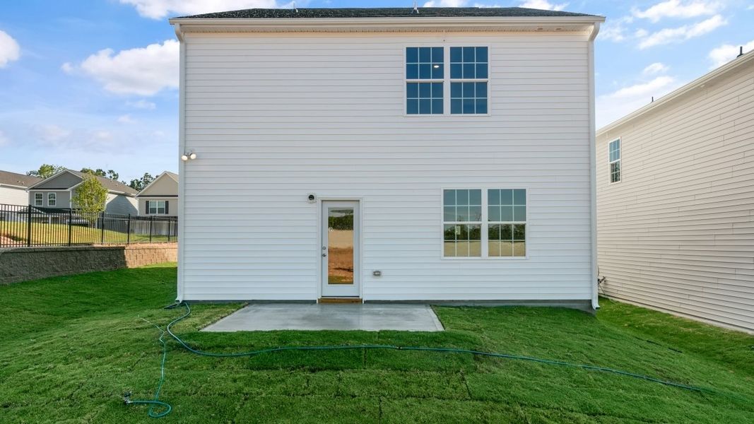 Exterior details and patio area of a home in The Grove at Matthews Landing, Fuquay Varina (Image 17).