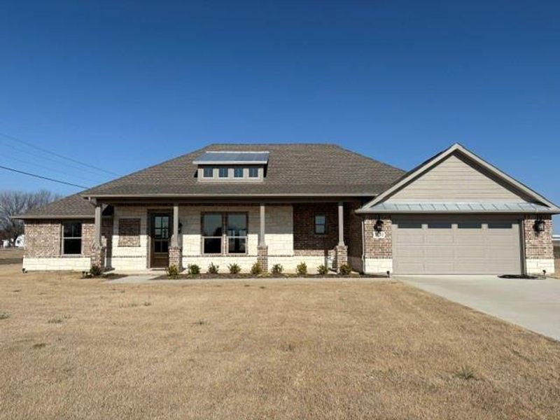 Front exterior of a new home in , Van Alstyne, TX, highlighting curb appeal (Image 22).