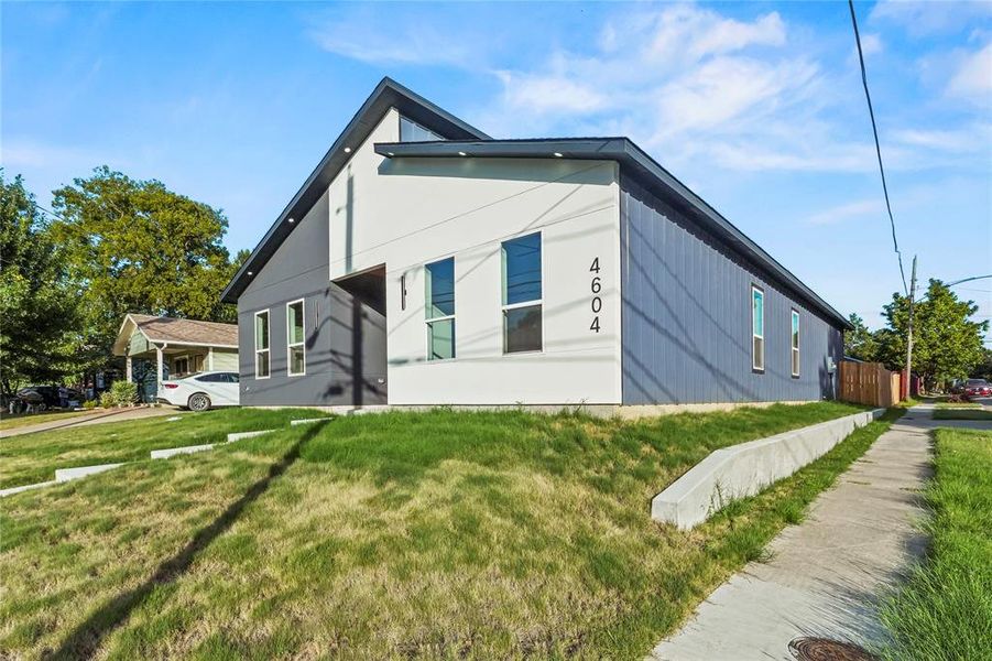 View of home's exterior with a yard