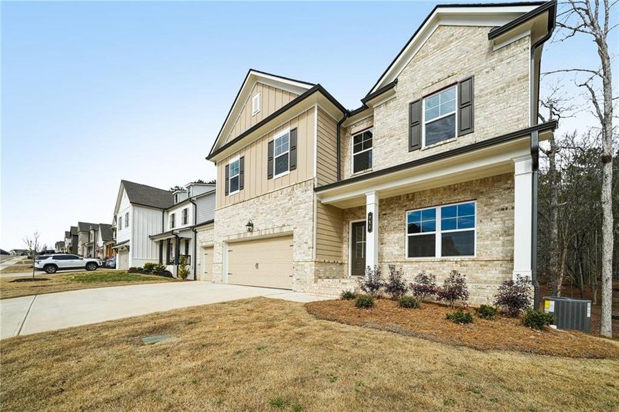 Front exterior of a new home in Rosewood Lake Estates, Hoschton, GA, highlighting curb appeal (Image 33).
