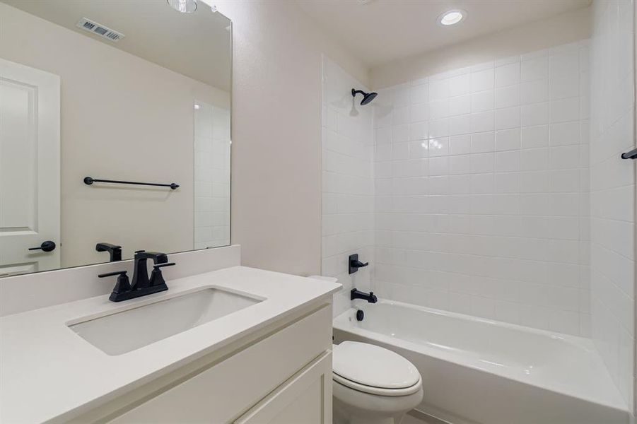 Full bathroom featuring vanity and shower / tub combination