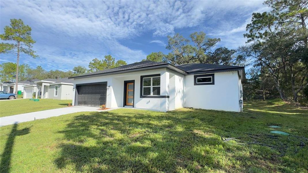 Front exterior of a new home in , Citrus Springs, FL, highlighting curb appeal (Image 16). Front exterior of a new home in , Citrus Springs, FL, highlighting curb appeal (Image 16).