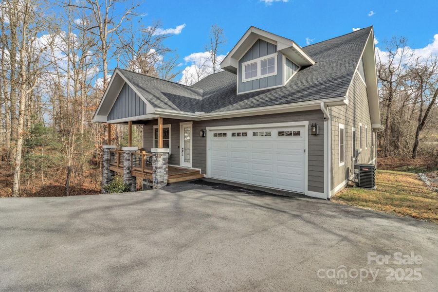 Front exterior of a new home in , Hendersonville, NC, highlighting curb appeal (Image 22).