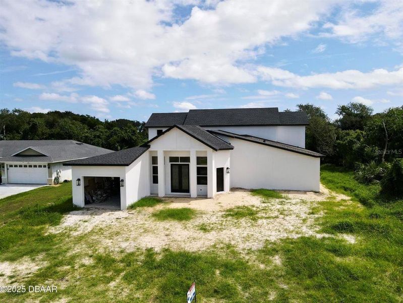 Front exterior of a new home in , Palm Coast, FL, highlighting curb appeal (Image 13).