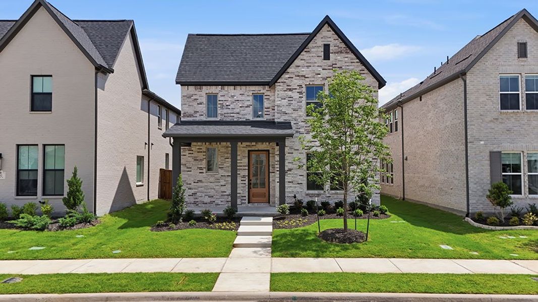 Front exterior of a new home in Light Farms Brenham - 40' Lots, Celina, TX, highlighting curb appeal (Image 27). Front exterior of a new home in Light Farms Brenham - 40' Lots, Celina, TX, highlighting curb appeal (Image 27).