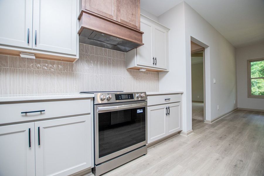 Furnished interior view inside a new home in WOODMONT RESERVE, Roopville (Image 11).