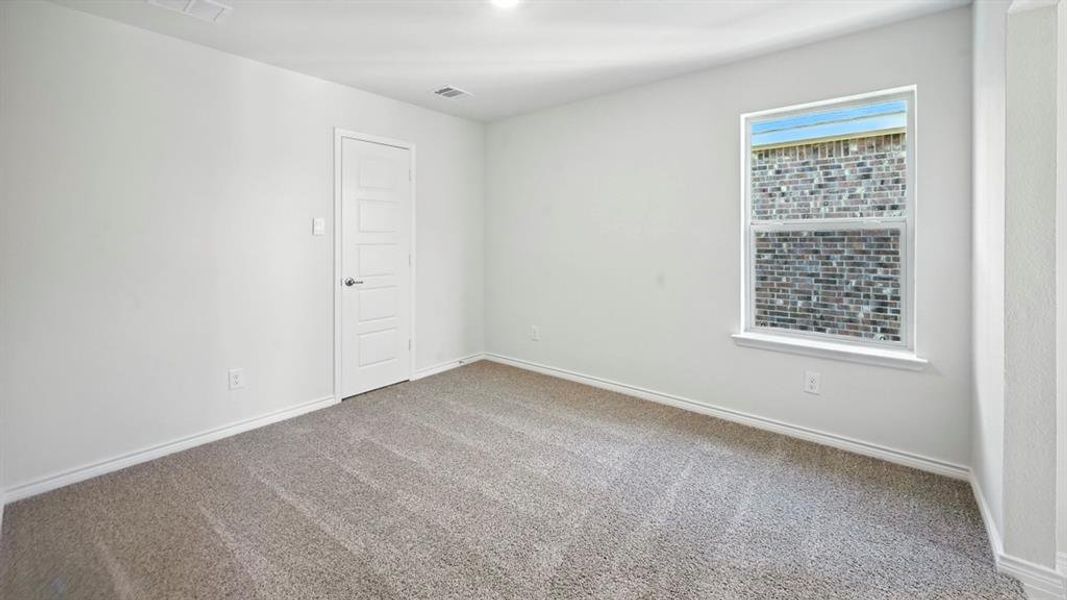 Empty room featuring carpet floors and baseboards Empty room featuring carpet floors and baseboards