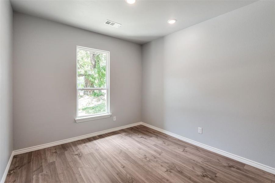 Unfurnished room featuring hardwood / wood-style flooring