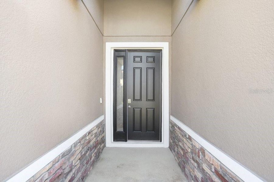 Exterior details and patio area of a home in Westgate at Avalon Park, Wesley Chapel (Image 3).