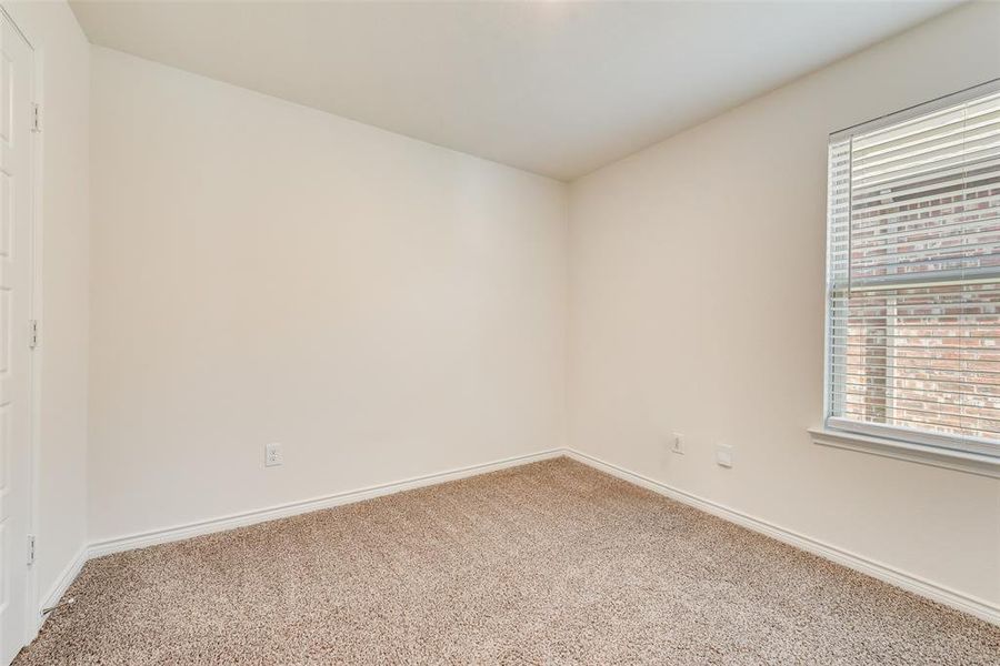 Empty room with light wood-style flooring, vaulted ceiling, and a ceiling fan Empty room with light wood-style flooring, vaulted ceiling, and a ceiling fan