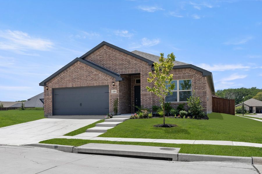 Front exterior of a new home in De Berry Reserve, Royse City, TX, highlighting curb appeal (Image 2). Front exterior of a new home in De Berry Reserve, Royse City, TX, highlighting curb appeal (Image 2).