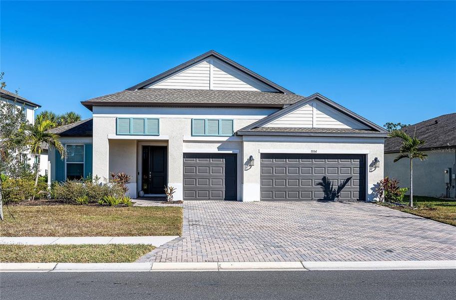 Front exterior of a new home in , Palmetto, FL, highlighting curb appeal (Image 2).