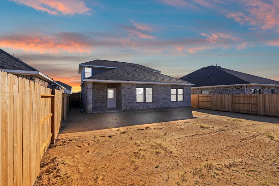 Exterior details and patio area of a home in Windrose Green, Angleton (Image 21).