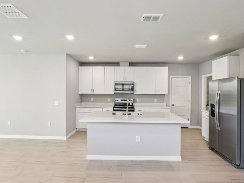 Furnished interior view inside a new home in Crescent Lakes - Premier Series, Punta Gorda (Image 7).