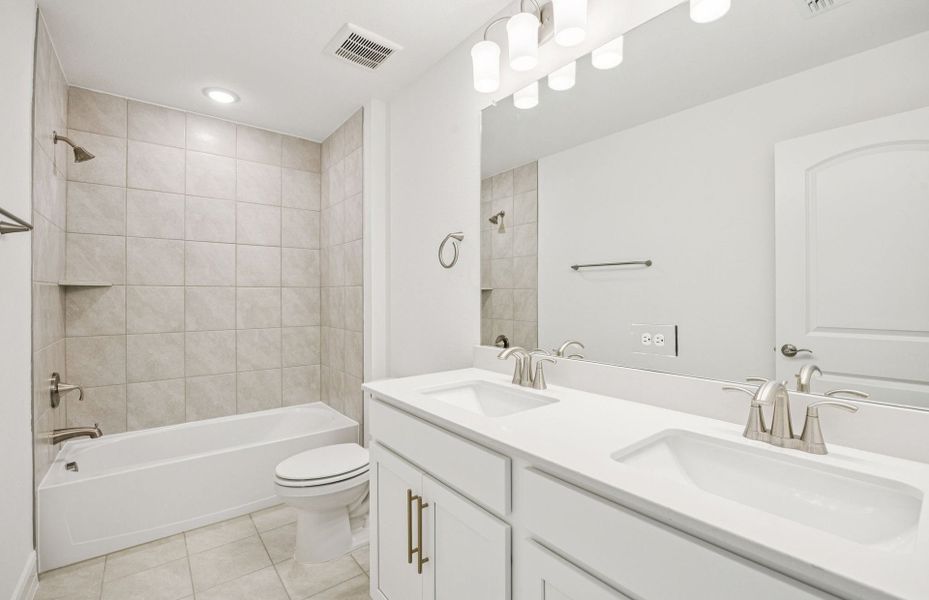 Secondary bathroom featuring modern upgrades and finishes  *Real home pictured