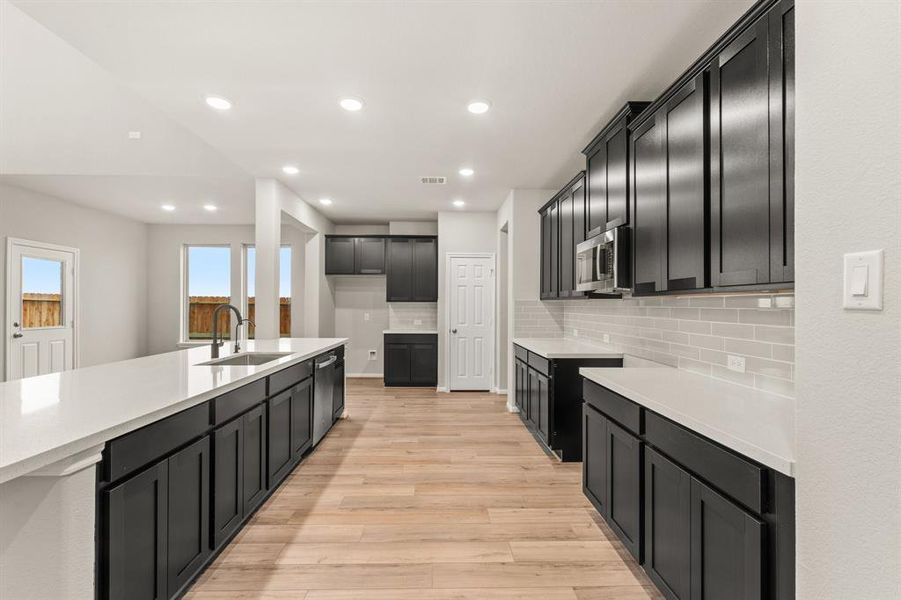 This kitchen is not only a functional space but also has ample storage. Whether you're a seasoned chef or just love to gather and enjoy good food, this kitchen is a dream come true.