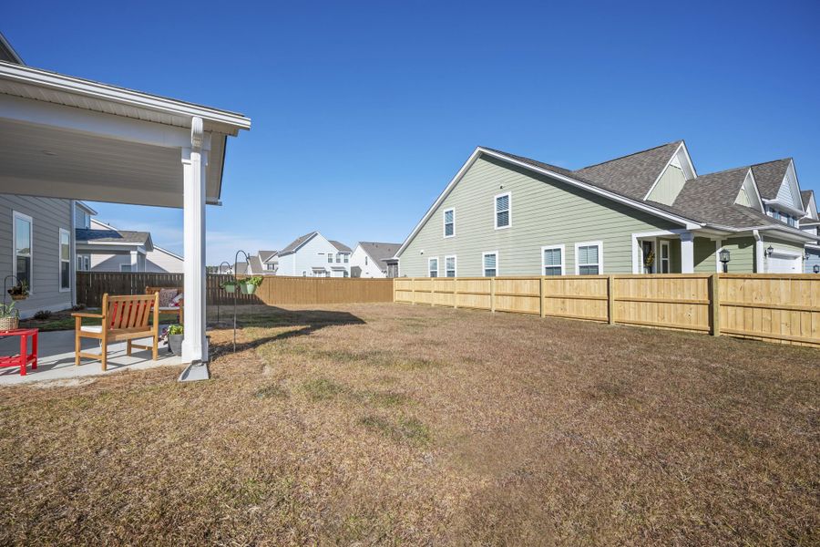 Exterior details and patio area of a home in High Point at Foxbank, Moncks Corner (Image 24).